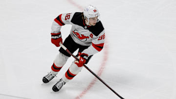 Feb 26, 2025; Denver, Colorado, USA; New Jersey Devils center Jack Hughes (86) controls the puck in the first period against the Colorado Avalanche at Ball Arena. Mandatory Credit: Isaiah J. Downing-Imagn Images