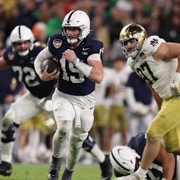 Penn State Nittany Lions quarterback Drew Allar runs the ball in the second half against the Notre Dame Fighting Irish in the Orange Bowl at Hard Rock Stadium. 