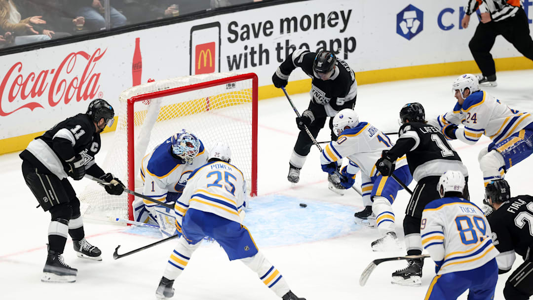 Nov 20, 2024; Los Angeles, California, USA;  Buffalo Sabres goaltender Ukko-Pekka Luukkonen (1) defends the goal against Los Angeles Kings right wing Quinton Byfield (55) during the third period at Crypto.com Arena. Mandatory Credit: Kiyoshi Mio-Imagn Images