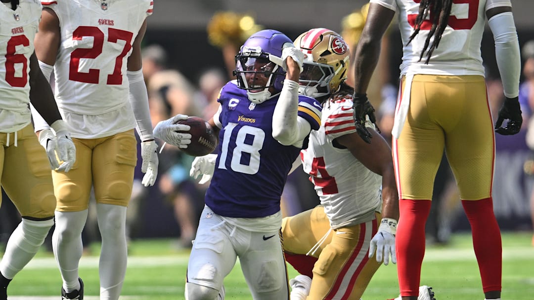 Sep 15, 2024; Minneapolis, Minnesota, USA; Minnesota Vikings wide receiver Justin Jefferson (18) reacts as San Francisco 49ers linebacker Fred Warner (54) looks on during the second quarter U.S. Bank Stadium. Mandatory Credit: Jeffrey Becker-Imagn Images