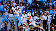 Oct 7, 2023; Chapel Hill, North Carolina, USA; North Carolina Tar Heels tight end Bryson Nesbit (18) reaches up for a touchdown catch during the first half of the game against the Syracuse Orange at Kenan Memorial Stadium. Mandatory Credit: Jaylynn Nash-Imagn Images