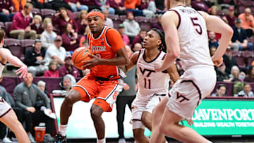 Mar 1, 2025; Blacksburg, Virginia, USA;  Syracuse Orange guard J.J. Starling (2) moves toward the basket as Virginia Tech Hokies guard Ben Hammond (11) defends during the first half at Cassell Coliseum. Mandatory Credit: Brian Bishop-Imagn Images