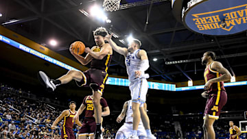 Feb 18, 2025; Los Angeles, California, USA; Minnesota Golden Gophers forward Dawson Garcia (3) grabs a rebound in front of UCLA Bruins forward Tyler Bilodeau (34) during the first half at Pauley Pavilion presented by Wescom. Mandatory Credit: Robert Hanashiro-Imagn Images