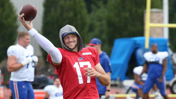 Bills quarterback Josh Allen warms up on the sidelines.