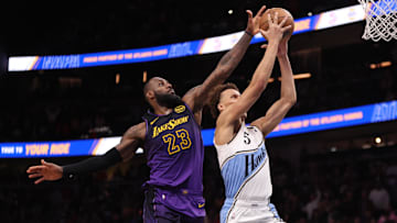 Dec 6, 2024; Atlanta, Georgia, USA; Los Angeles Lakers forward LeBron James (23) blocks the shot of Atlanta Hawks guard Dyson Daniels (5) in overtime at State Farm Arena. Mandatory Credit: Brett Davis-Imagn Images