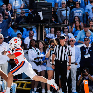 Oct 7, 2023; Chapel Hill, North Carolina, USA; North Carolina Tar Heels tight end Bryson Nesbit (18) reaches up for a touchdown catch during the first half of the game against the Syracuse Orange at Kenan Memorial Stadium. Mandatory Credit: Jaylynn Nash-Imagn Images