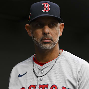 Aug 16, 2024; Baltimore, Maryland, USA; Boston Red Sox manager Alex Cora (13) stands in the dugout during the first inning of the game against the Baltimore Orioles  at Oriole Park at Camden Yards. Mandatory Credit: Tommy Gilligan-Imagn Images