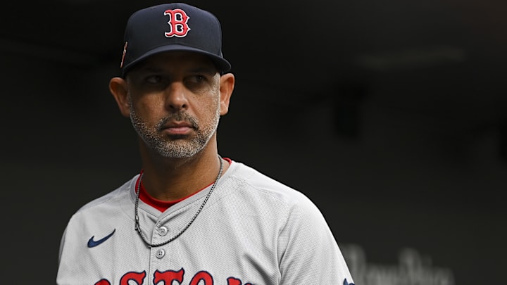 Aug 16, 2024; Baltimore, Maryland, USA; Boston Red Sox manager Alex Cora (13) stands in the dugout during the first inning of the game against the Baltimore Orioles  at Oriole Park at Camden Yards. Mandatory Credit: Tommy Gilligan-Imagn Images