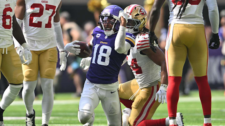 Sep 15, 2024; Minneapolis, Minnesota, USA; Minnesota Vikings wide receiver Justin Jefferson (18) reacts as San Francisco 49ers linebacker Fred Warner (54) looks on during the second quarter U.S. Bank Stadium.