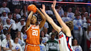 Jan 29, 2025; Oxford, Mississippi, USA; Texas Longhorns guard Tre Johnson (20) shoots fa three point basket as Mississippi Rebels guard Eduardo Klafke (8) defends during the first half at The Sandy and John Black Pavilion at Ole Miss. Mandatory Credit: Petre Thomas-Imagn Images