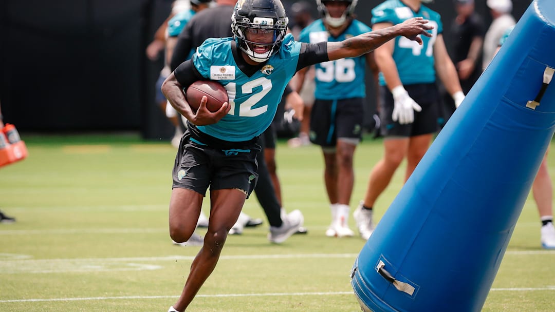 May 10, 2025; Jacksonville, FL, USA; Jacksonville Jaguars wide receiver Travis Hunter (12) runs after completing a passing drill during rookie minicamp at Miller Electric Center. Mandatory Credit: Travis Register-Imagn Images