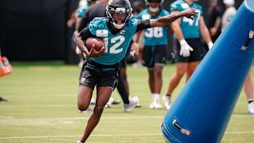 May 10, 2025; Jacksonville, FL, USA; Jacksonville Jaguars wide receiver Travis Hunter (12) runs after completing a passing drill during rookie minicamp at Miller Electric Center. Mandatory Credit: Travis Register-Imagn Images