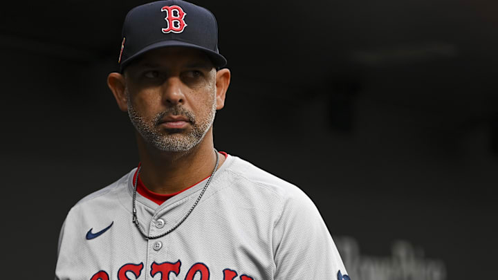 Aug 16, 2024; Baltimore, Maryland, USA; Boston Red Sox manager Alex Cora (13) stands in the dugout during the first inning of the game against the Baltimore Orioles  at Oriole Park at Camden Yards. Mandatory Credit: Tommy Gilligan-Imagn Images