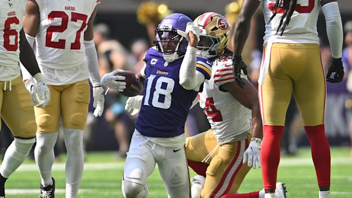 Sep 15, 2024; Minneapolis, Minnesota, USA; Minnesota Vikings wide receiver Justin Jefferson (18) reacts as San Francisco 49ers linebacker Fred Warner (54) looks on during the second quarter U.S. Bank Stadium. Mandatory Credit: Jeffrey Becker-Imagn Images