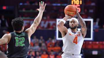 Dec 29, 2024; Champaign, Illinois, USA;  Illinois Fighting Illini guard Kylan Boswell (4) shoots the ball over Chicago State Cougars guard Gabe Spinelli (12) during the first half at State Farm Center. Mandatory Credit: Ron Johnson-Imagn Images