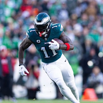 Dec 31, 2023; Philadelphia, Pennsylvania, USA; Philadelphia Eagles wide receiver A.J. Brown (11) runs with the ball during the fourth quarter against the Arizona Cardinals at Lincoln Financial Field. Mandatory Credit: Bill Streicher-Imagn Images