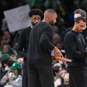 Apr 5, 2024; Boston, Massachusetts, USA; Boston Celtics head coach Joe Mazzulla (center) works with coaching staff to diagram a play during the first half against the Sacramento Kings at TD Garden. Mandatory Credit: Eric Canha-USA TODAY Sports