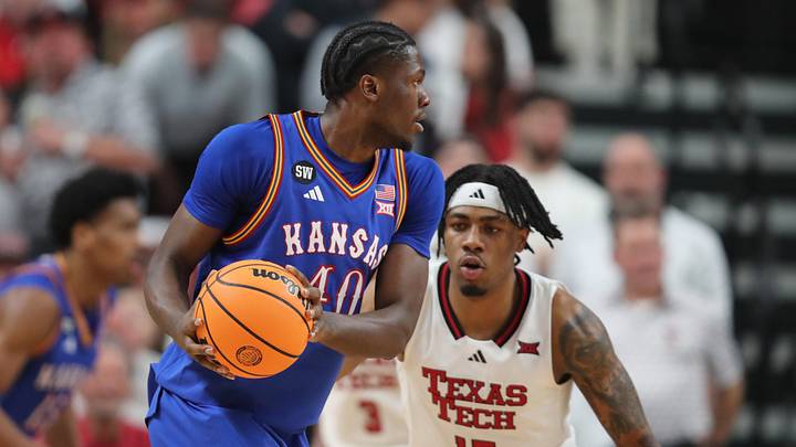 Feb 2, 2026; Lubbock, Texas, USA;  Kansas Jayhawks forward Flory Bidunga (40) keeps the ball from Texas Tech Red Raiders forward JT Toppin (15) in the first half at United Supermarkets Arena. Mandatory Credit: Michael C. Johnson-Imagn Images