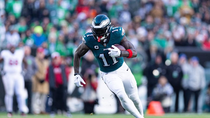 Dec 31, 2023; Philadelphia, Pennsylvania, USA; Philadelphia Eagles wide receiver A.J. Brown (11) runs with the ball during the fourth quarter against the Arizona Cardinals at Lincoln Financial Field. Mandatory Credit: Bill Streicher-Imagn Images