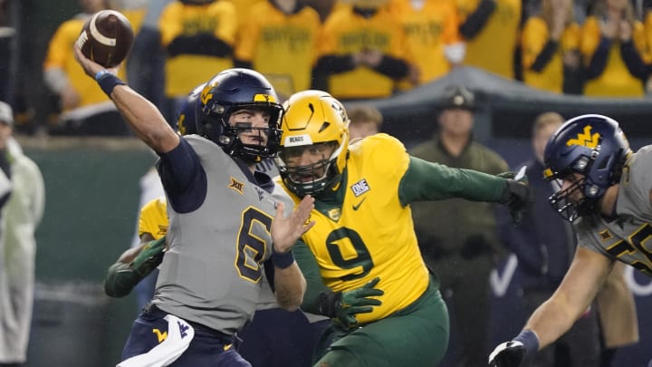 Nov 25, 2023; Waco, Texas, USA; West Virginia Mountaineers quarterback Garrett Greene (6) throws downfield against the Baylor Bears during the first half at McLane Stadium.