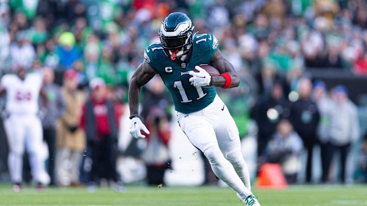 Dec 31, 2023; Philadelphia, Pennsylvania, USA; Philadelphia Eagles wide receiver A.J. Brown (11) runs with the ball during the fourth quarter against the Arizona Cardinals at Lincoln Financial Field. Mandatory Credit: Bill Streicher-Imagn Images