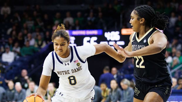 Notre Dame guard Cassandre Prosper (8) drives the ball past Wake Forest guard Madisyn Jordan (22) 