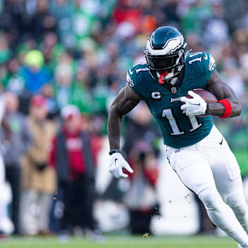 Dec 31, 2023; Philadelphia, Pennsylvania, USA; Philadelphia Eagles wide receiver A.J. Brown (11) runs with the ball during the fourth quarter against the Arizona Cardinals at Lincoln Financial Field. Mandatory Credit: Bill Streicher-Imagn Images