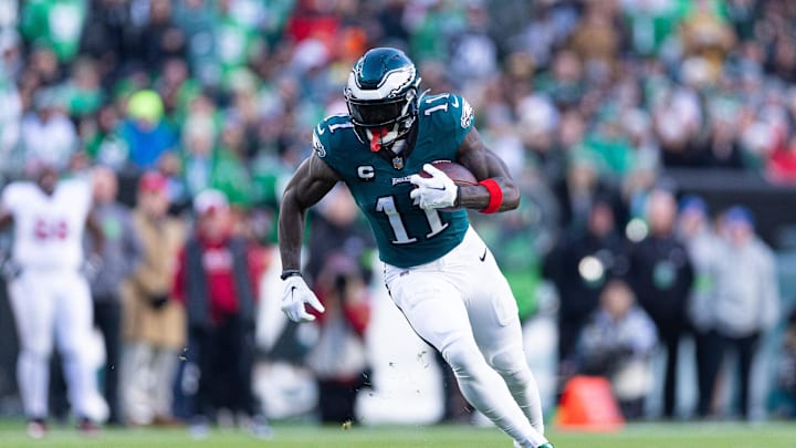 Dec 31, 2023; Philadelphia, Pennsylvania, USA; Philadelphia Eagles wide receiver A.J. Brown (11) runs with the ball during the fourth quarter against the Arizona Cardinals at Lincoln Financial Field. Mandatory Credit: Bill Streicher-Imagn Images