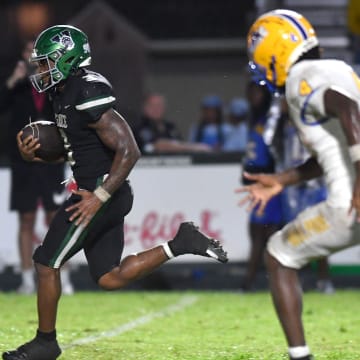 Miami Northwestern defensive back J'Vari Flowers (#4) is unable to catch Venice High running back Jamarice Wilder (#3) on his way to the end zone untouched. The Venice High Indians hosted the Miami Northwestern Bulls in a non-conference game Friday evening, Aug. 30, 2024.