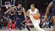 Nov 9, 2024; Houston, Texas, USA; Houston Cougars guard Milos Uzan (7) dribbles the ball as Auburn Tigers guard Chad Baker-Mazara (10) defends during the second half at Toyota Center. Mandatory Credit: Troy Taormina-Imagn Images