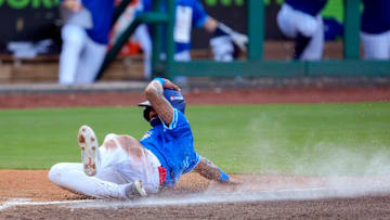 Oklahoma City Comets outfielder Jose Ramos (18) slides home to score a run during a minor league baseball game between the Oklahoma City Comets and the Sugar Land Space Cowboys at Chickasaw Bricktown Ballpark in Oklahoma City on July 9.