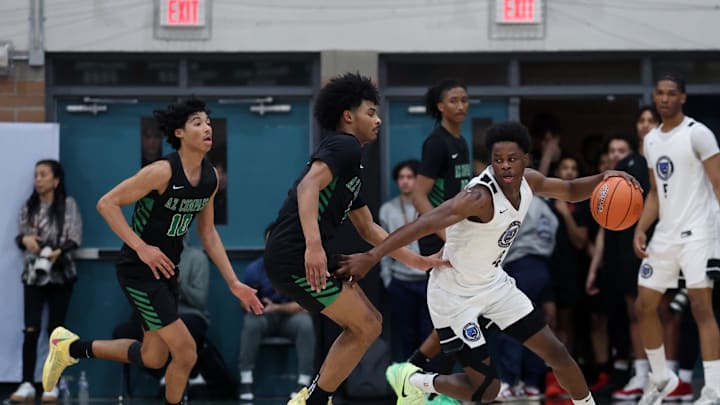 Jan 3, 2025; Gilbert, AZ, USA; CIA Bella Vista (AZ) guard Aginaldo Neto (4) against Arizona Compass Prep guard Kalek House (5) and brother Kaden House (10) during the Hoophall West High School Invitational at Highland High School. Mandatory Credit: Mark J. Rebilas-Imagn Images