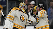 Nov 2, 2023; Boston, Massachusetts, USA; Boston Bruins left wing Brad Marchand (63) celebrates with goaltender Jeremy Swayman (1) after an overtime win against the Toronto Maple Leafs at the TD Garden. Mandatory Credit: Brian Fluharty-Imagn Images