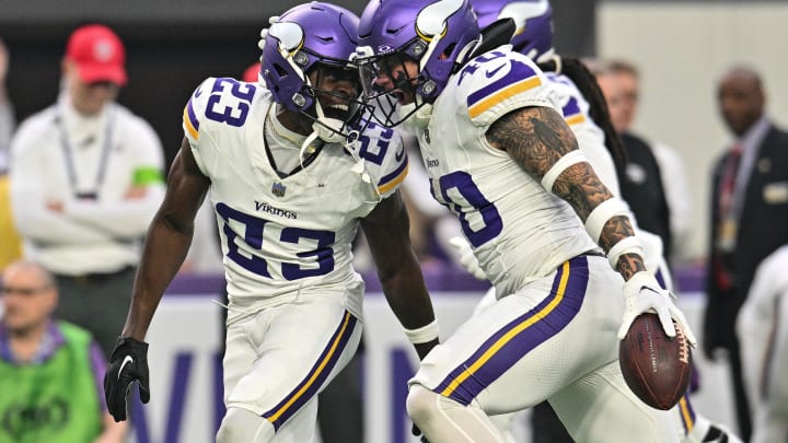 Dec 24, 2023; Minneapolis, Minnesota, USA; Minnesota Vikings cornerback Andrew Booth Jr. (23) and linebacker Ivan Pace Jr. (40) react after a fumble recovery against the Detroit Lions during the game at U.S. Bank Stadium. 