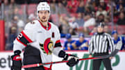 Jan 9, 2025; Ottawa, Ontario, CAN; Ottawa Senators defenseman Thomas Chabot (72) gets in position for a faceoff in the first period against the Buffalo Sabres at the Canadian Tire Centre. Mandatory Credit: Marc DesRosiers-Imagn Images