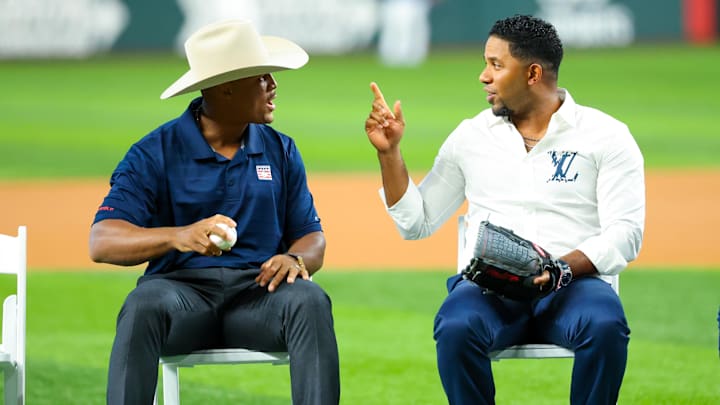 Aug 17, 2024; Arlington, Texas, USA;  Texas Rangers Hall of Fame player Adrian Beltre laughs with former player Elvis Andrus before the game against the Minnesota Twins at Globe Life Field. Mandatory Credit: Kevin Jairaj-Imagn Images