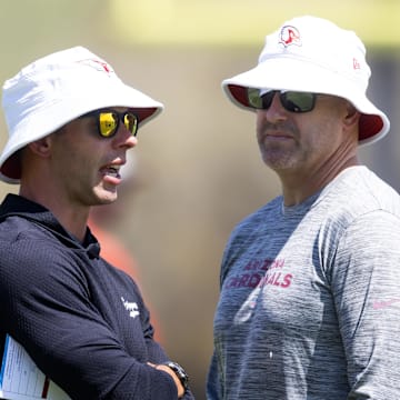 Jun 10, 2025; Tempe, AZ, USA; Arizona Cardinals head coach Jonathan Gannon (left) with general manager Monti Ossenfort during minicamp at the teams Arizona Cardinals Training Facility. Mandatory Credit: Mark J. Rebilas-Imagn Images