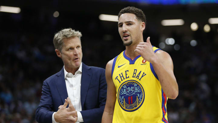 Mar 31, 2018; Sacramento, CA, USA; Golden State Warriors guard Klay Thompson (11) talks with head coach Steve Kerr during a break in the action against the Sacramento Kings in the second quarter at the Golden 1 Center. Mandatory Credit: Cary Edmondson-USA TODAY Sports