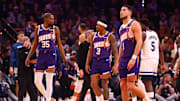 Jan 29, 2025; Phoenix, Arizona, USA; Phoenix Suns forward Kevin Durant (35) with guard Bradley Beal (3) and Devin Booker (1) against the Minnesota Timberwolves at Footprint Center. Mandatory Credit: Mark J. Rebilas-Imagn Images