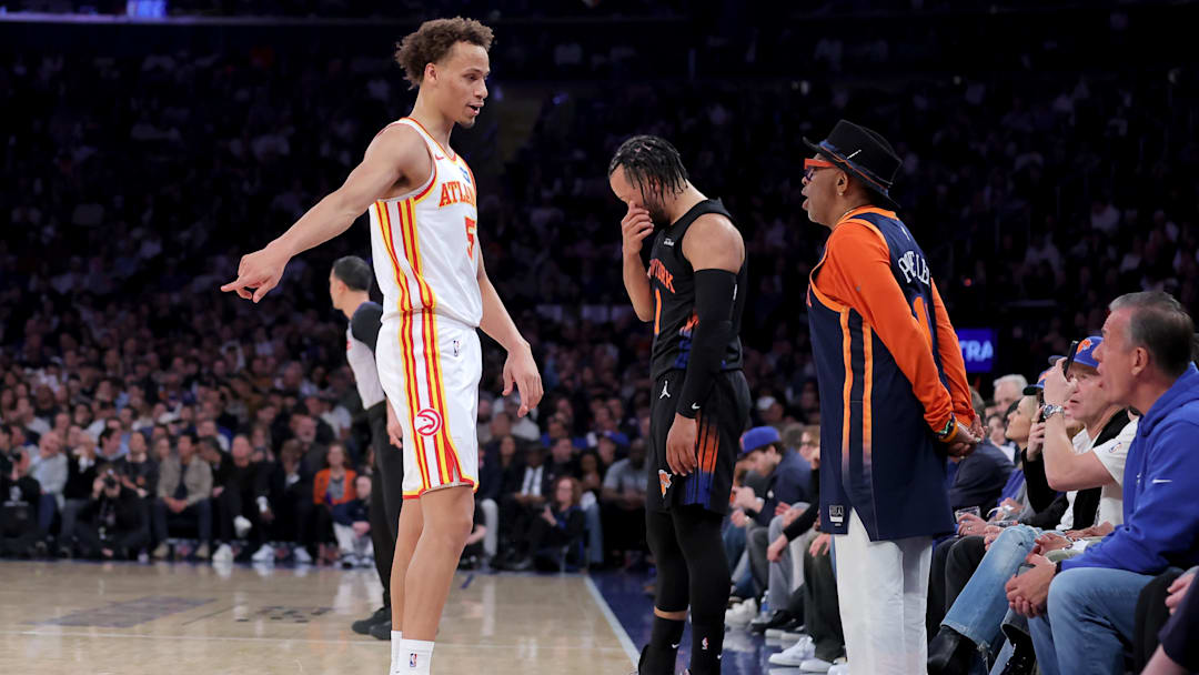 Apr 20, 2026; New York, New York, USA; Atlanta Hawks guard Dyson Daniels (5) talks to Knicks fan Spike Lee after fouling New York Knicks guard Jalen Brunson (11) during the first quarter of game two of the first round of the 2026 NBA Playoffs at Madison Square Garden. Mandatory Credit: Brad Penner-Imagn Images