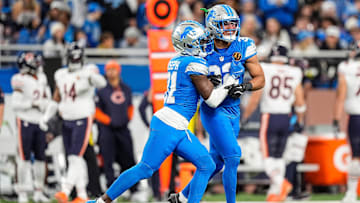 Detroit Lions safety Kerby Joseph (31), left, and safety Brian Branch (32) celebrate a play against Chicago Bears during the first half at Ford Field in Detroit on Thursday, Nov. 28, 2024.
