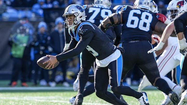 Dec 22, 2024; Charlotte, North Carolina, USA; Carolina Panthers quarterback Bryce Young (9) turns to hand off the ball against the Arizona Cardinals during the second quarter at Bank of America Stadium. Mandatory Credit: Jim Dedmon-Imagn Images Dec 22, 2024; Charlotte, North Carolina, USA; Carolina Panthers quarterback Bryce Young (9) turns to hand off the ball against the Arizona Cardinals during the second quarter at Bank of America Stadium. Mandatory Credit: Jim Dedmon-Imagn Images