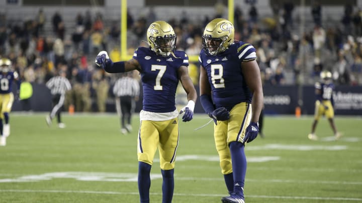 Oct 20, 2022; Atlanta, Georgia, USA; Georgia Tech Yellow Jackets defensive back Zamari Walton (7) celebrates with defensive lineman Makius Scott (8) after an interception against the Virginia Cavaliers in the first half at Bobby Dodd Stadium. Mandatory Credit: Brett Davis-USA TODAY Sports
