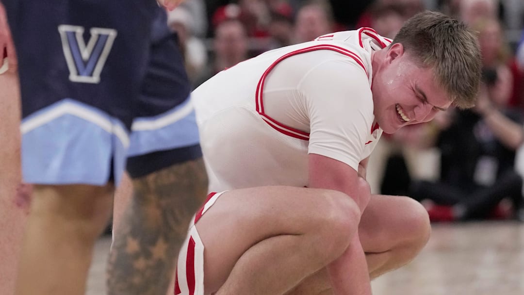 Wisconsin forward Nolan Winter (31) winces after colliding with a Villanova player during the second half of their game Friday, December 19, 2025 at Fiserv Forum in Milwaukee, Wisconsin. Villanova beat Wisconsin 76-66 in overtime. No foul was called.