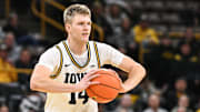 Nov 20, 2025; Iowa City, Iowa, USA; Iowa Hawkeyes guard Bennett Stirtz (14) looks to pass the ball against the Chicago State Cougars during the second half at Carver-Hawkeye Arena. Mandatory Credit: Jeffrey Becker-Imagn Images