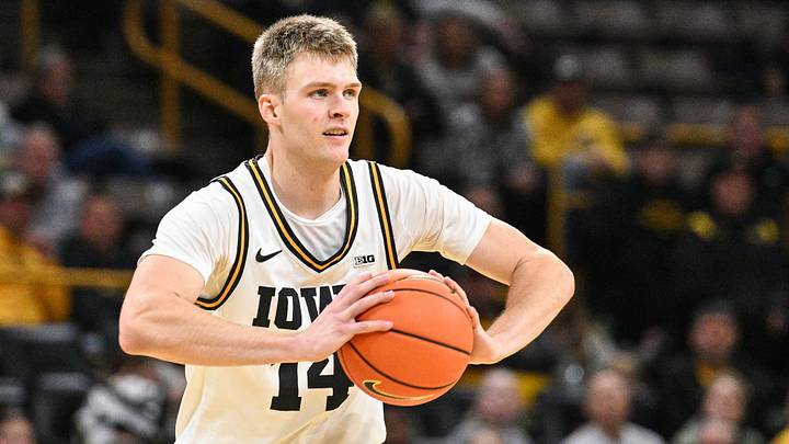 Nov 20, 2025; Iowa City, Iowa, USA; Iowa Hawkeyes guard Bennett Stirtz (14) looks to pass the ball against the Chicago State Cougars during the second half at Carver-Hawkeye Arena. Mandatory Credit: Jeffrey Becker-Imagn Images