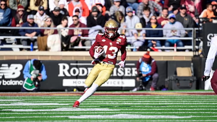 Nov 11, 2023; Chestnut Hill, Massachusetts, USA; Boston College Eagles wide receiver Dino Tomlin (13) runs the ball during the first half against the Virginia Tech Hokies at Alumni Stadium. Mandatory Credit: Eric Canha-Imagn Images