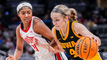 Ohio State Buckeyes guard Chance Gray (21) guards Iowa Hawkeyes guard Kylie Feuerbach (4) on Friday, March 7, 2025, in a quarterfinals game at the 2025 TIAA Big Ten Women's Basketball Tournament between the Iowa Hawkeyes and the Ohio State Buckeyes at Gainbridge Fieldhouse in Indianapolis. The Buckeyes defeated the Hawkeyes, 60-59.