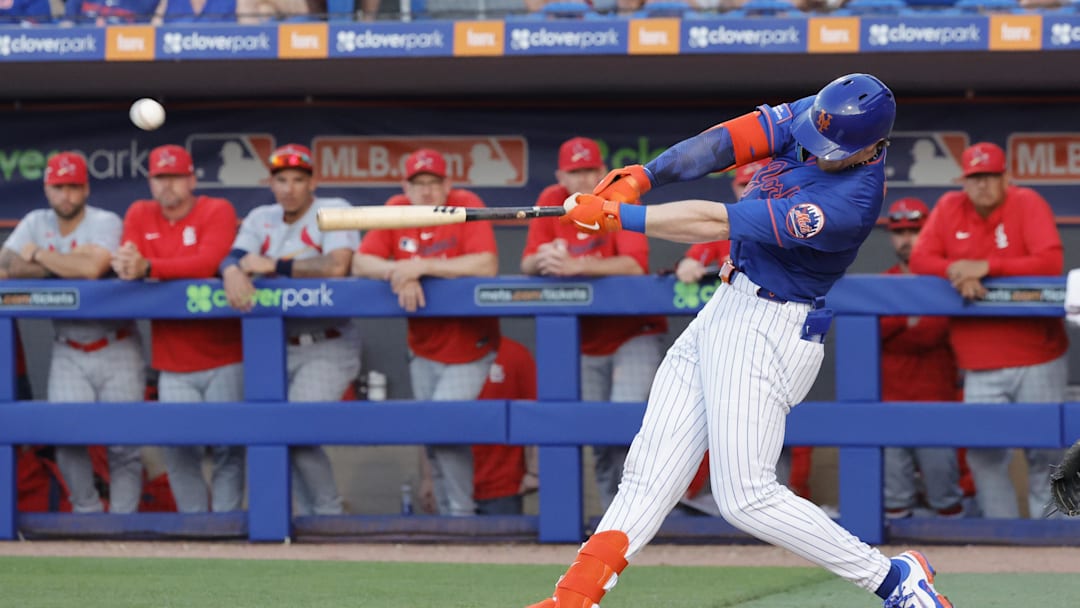 Mar 14, 2025; Port St. Lucie, Florida, USA;  New York Mets third baseman Brett Baty (7) hits a double during the fourth inning against the St. Louis Cardinals at Clover Park. Mandatory Credit: Reinhold Matay-Imagn Images