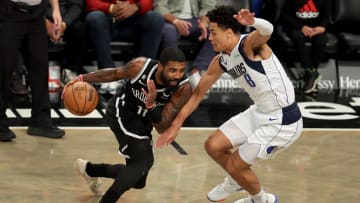 Oct 27, 2022; Brooklyn, New York, USA; Brooklyn Nets guard Kyrie Irving (11) controls the ball against Dallas Mavericks guard Josh Green (8) during the fourth quarter at Barclays Center. Mandatory Credit: Brad Penner-USA TODAY Sports